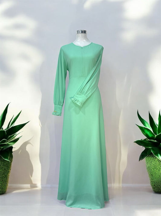 Minimalist Dress,
Mint, invisible zip at
the front, ruffles on
the cuffs and zip on
the sleeves