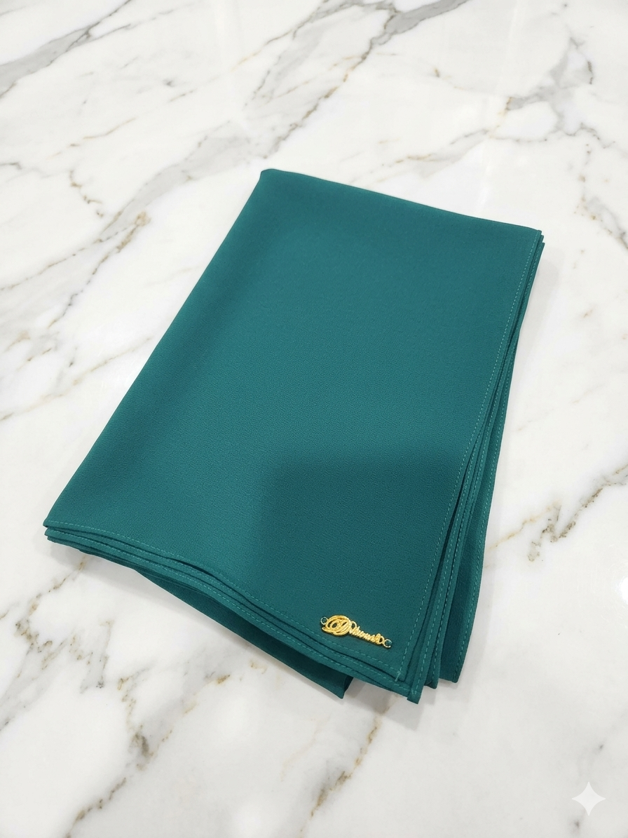 Graceful chiffon shawls with a soft, flowy drape. Light and airy, perfect for everyday wear or special occasions, finished with a subtle logo for a touch of understated elegance.