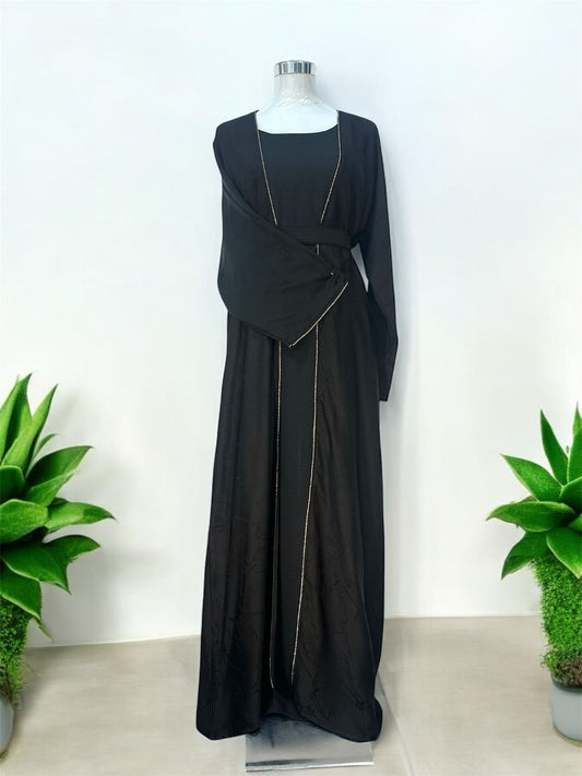 Embrace timeless sophistication with this elegant Amani Abaya, designed with a minimalist silhouette and subtle textured floral detailing throughout. Accented with delicate shimmer trim along the front opening and sleeve edges, this piece offers a refined and graceful look for any occasion. The flowing cut and matching waist belt create a flattering silhouette while maintaining effortless comfort.