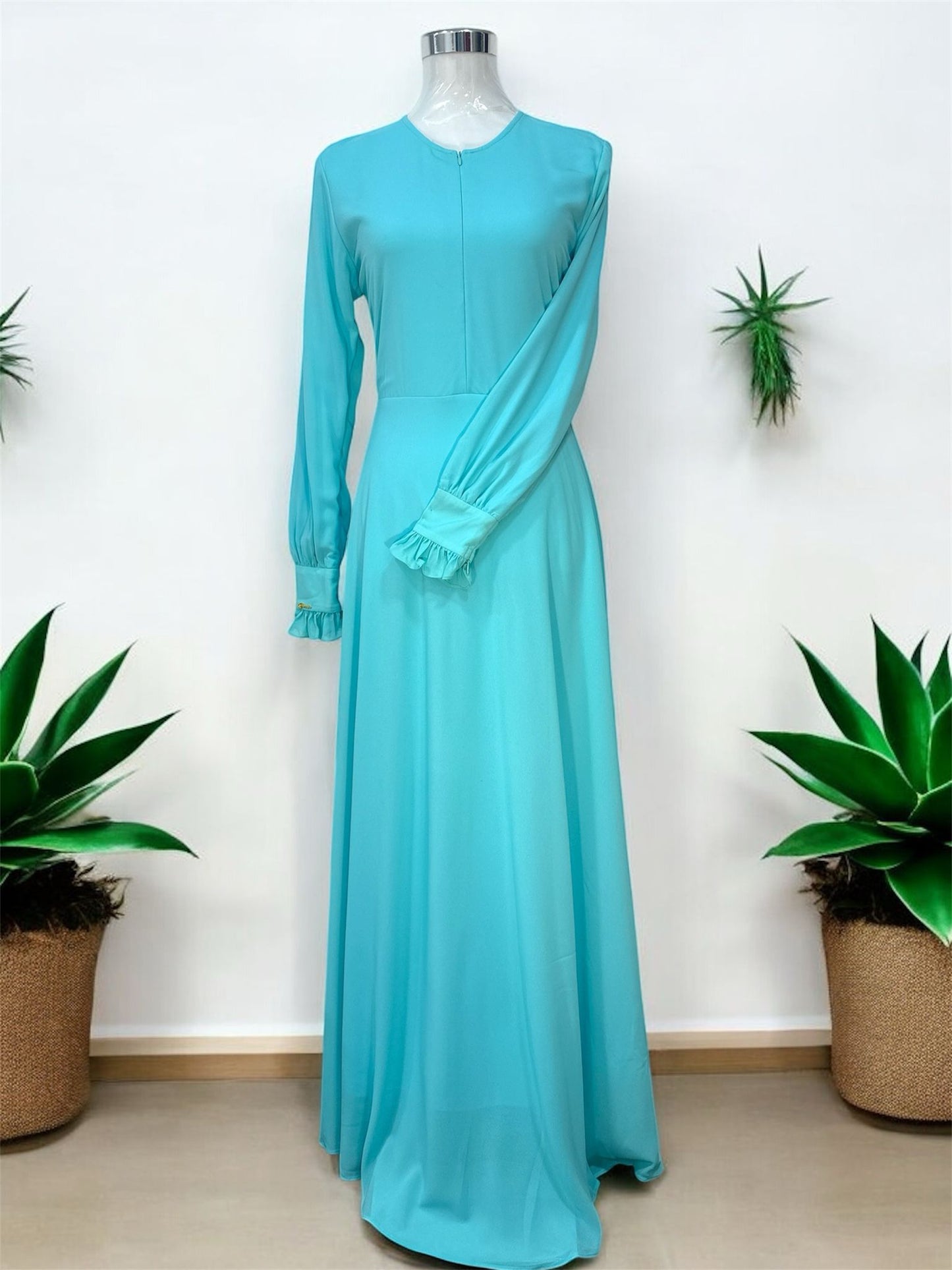 Minimalist Dress,
Blue, invisible zip at
the front, ruffles on
the cuffs and zip on
the sleeves