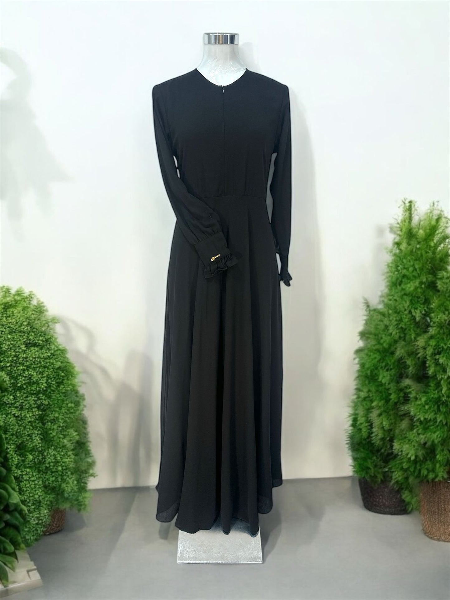 Minimalist Dress,
Black, invisible zip
at the front, ruffles on
the cuffs and zip on
the sleeves