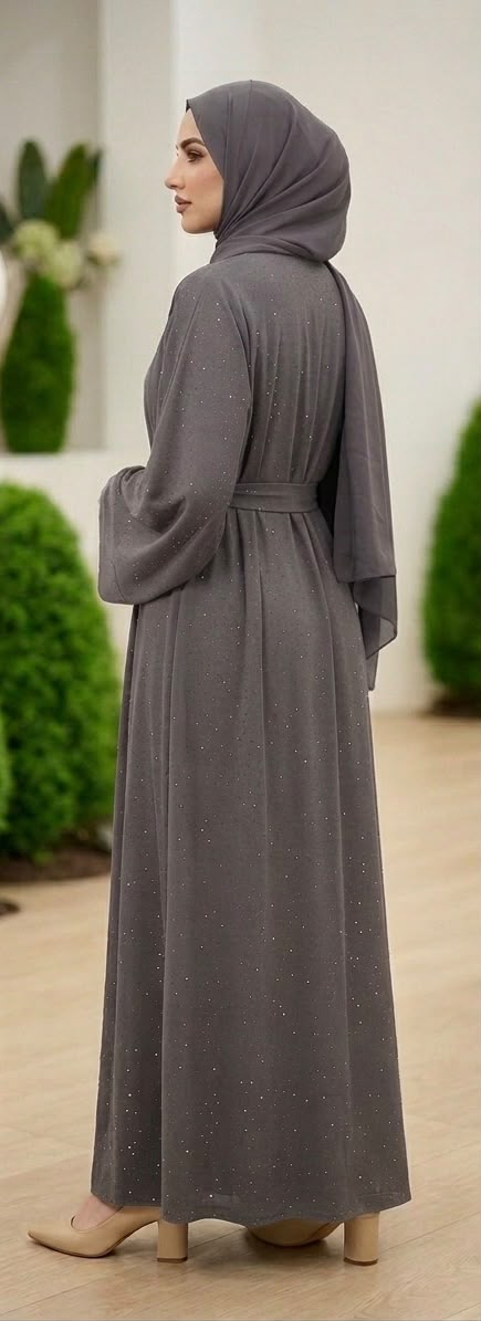 Grey Lamura Abaya was designed in an overcoat style, featuring delicate blue stone embellishments across the overcoat for sophisticated looks and short sleeve innerwear providing comfort. Comes complete with a coordinating cloth belt and matching shawl.