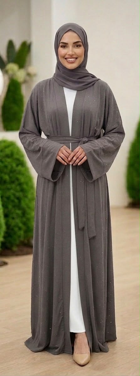 Grey Lamura Abaya was designed in an overcoat style, featuring delicate blue stone embellishments across the overcoat for sophisticated looks and short sleeve innerwear providing comfort. Comes complete with a coordinating cloth belt and matching shawl.