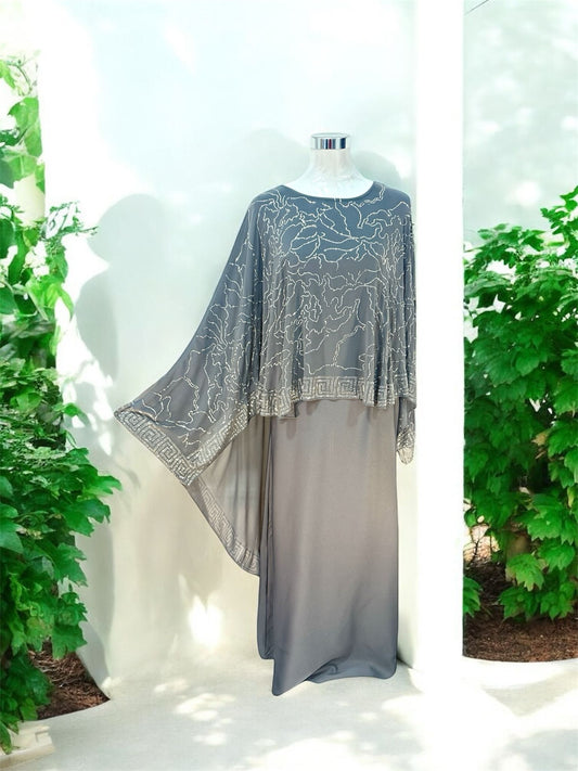 Our Riwaa Abaya designed with a flowing cape, featuring delicate bead embroidery across the cape for a graceful, understated elegance. Comes complete with a matching shawl.