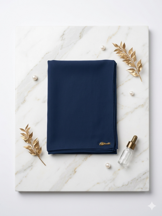Graceful chiffon shawls with a soft, flowy drape. Light and airy, perfect for everyday wear or special occasions, finished with a subtle logo for a touch of understated elegance.