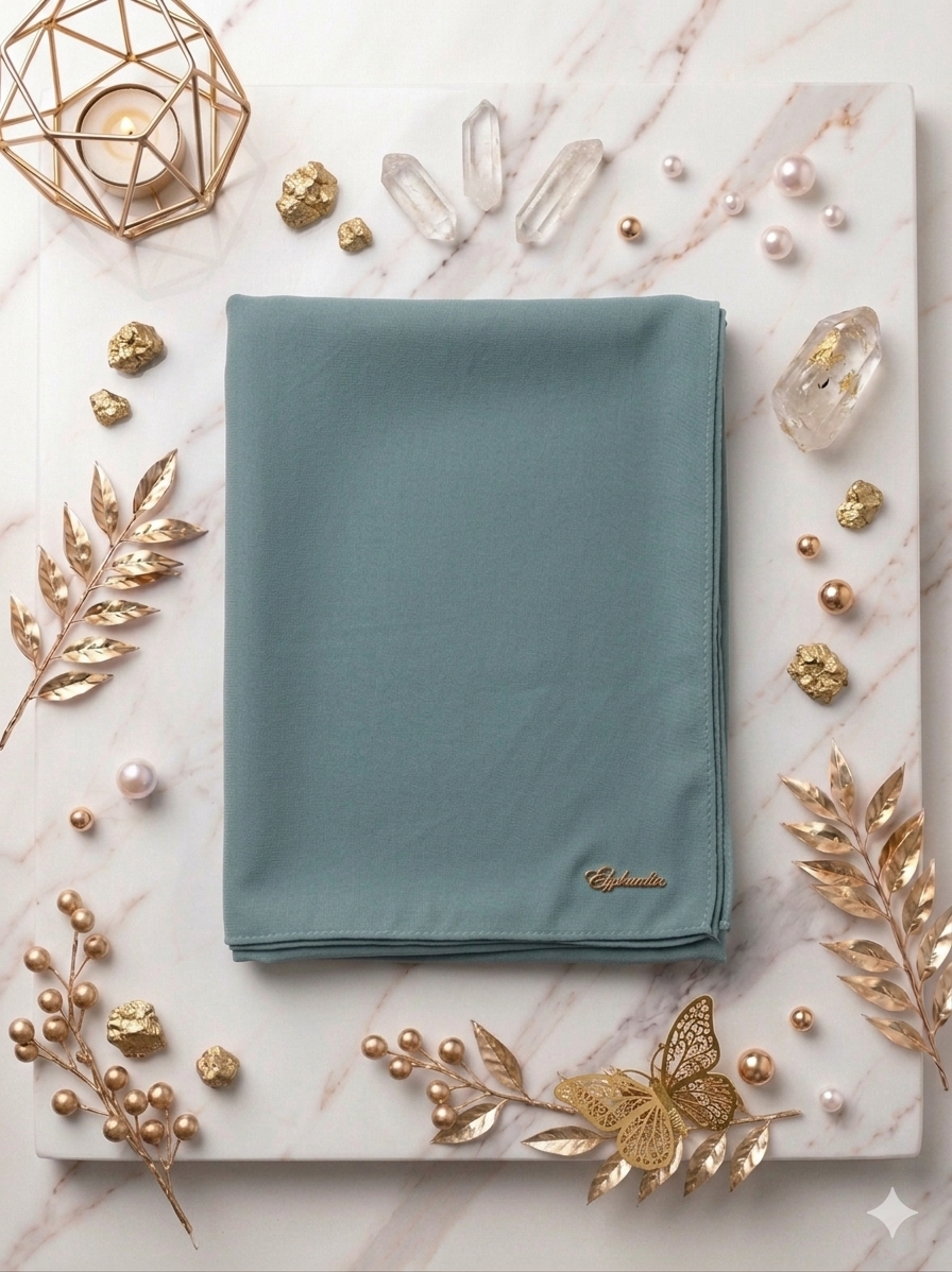 Graceful chiffon shawls with a soft, flowy drape. Light and airy, perfect for everyday wear or special occasions, finished with a subtle logo for a touch of understated elegance.