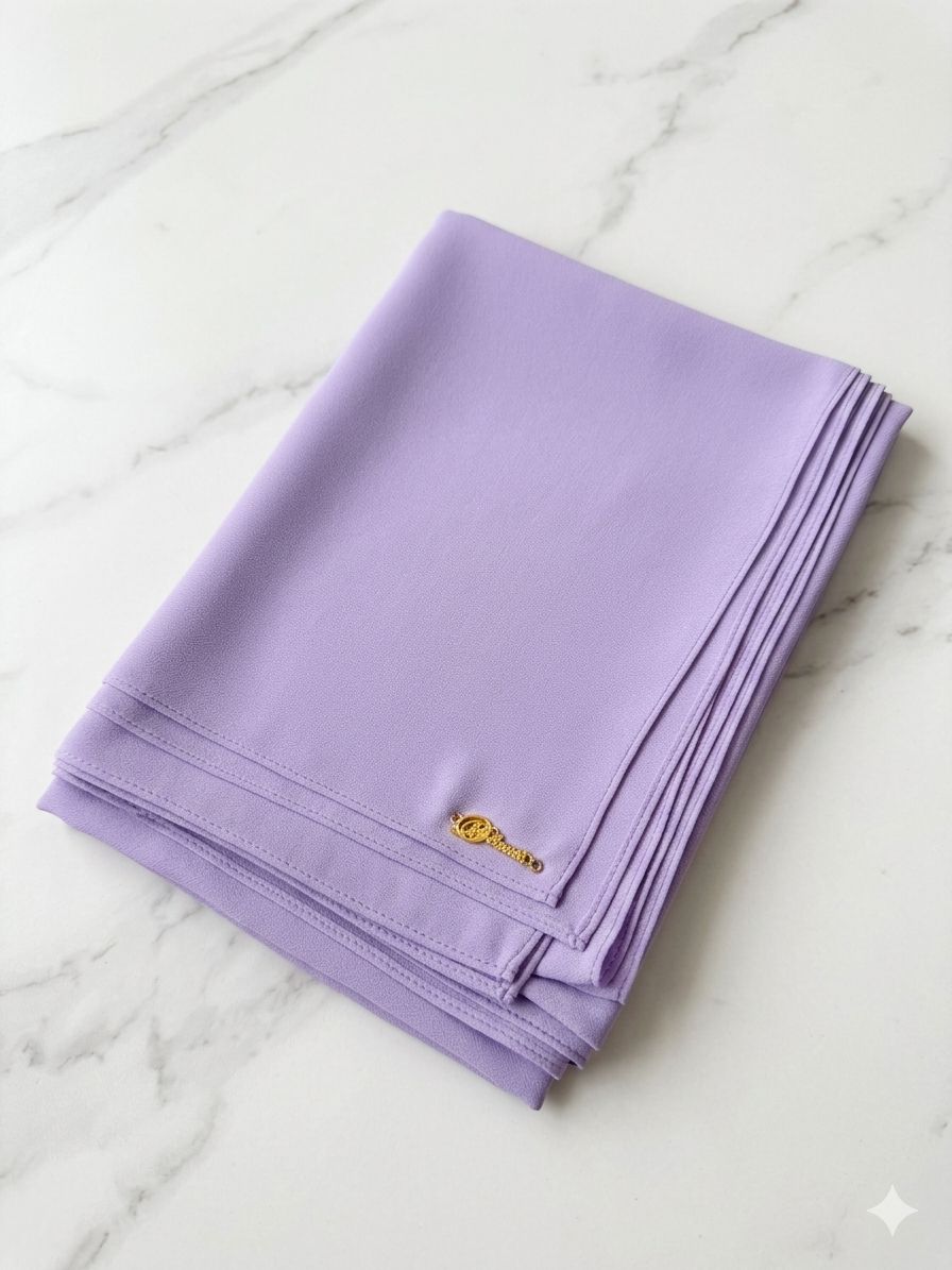Graceful chiffon shawls with a soft, flowy drape. Light and airy, perfect for everyday wear or special occasions, finished with a subtle logo for a touch of understated elegance.
