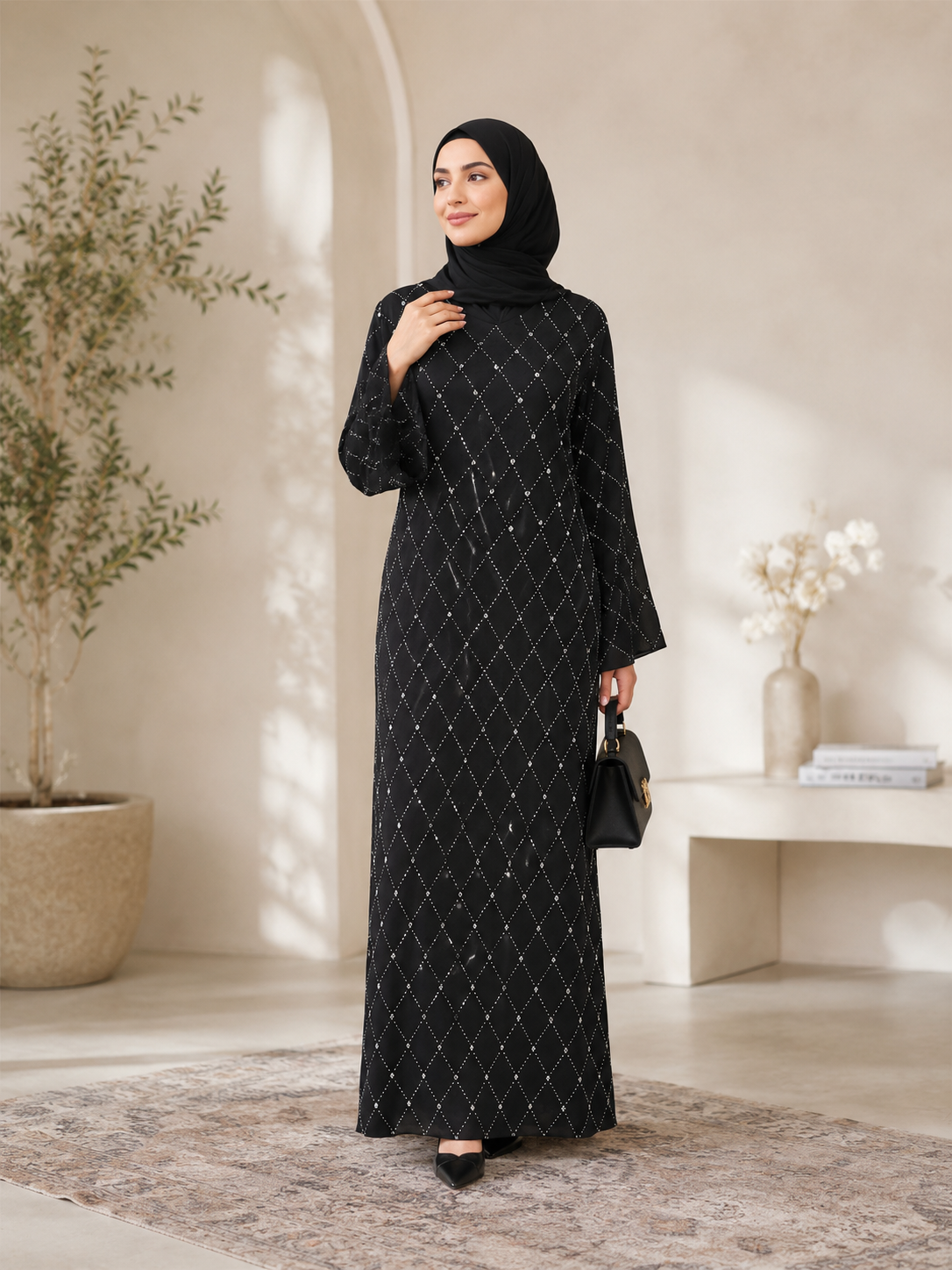 Black closed abaya with V-neck, small whites stones across abaya and adorned with raised stones that added texture and sparkles