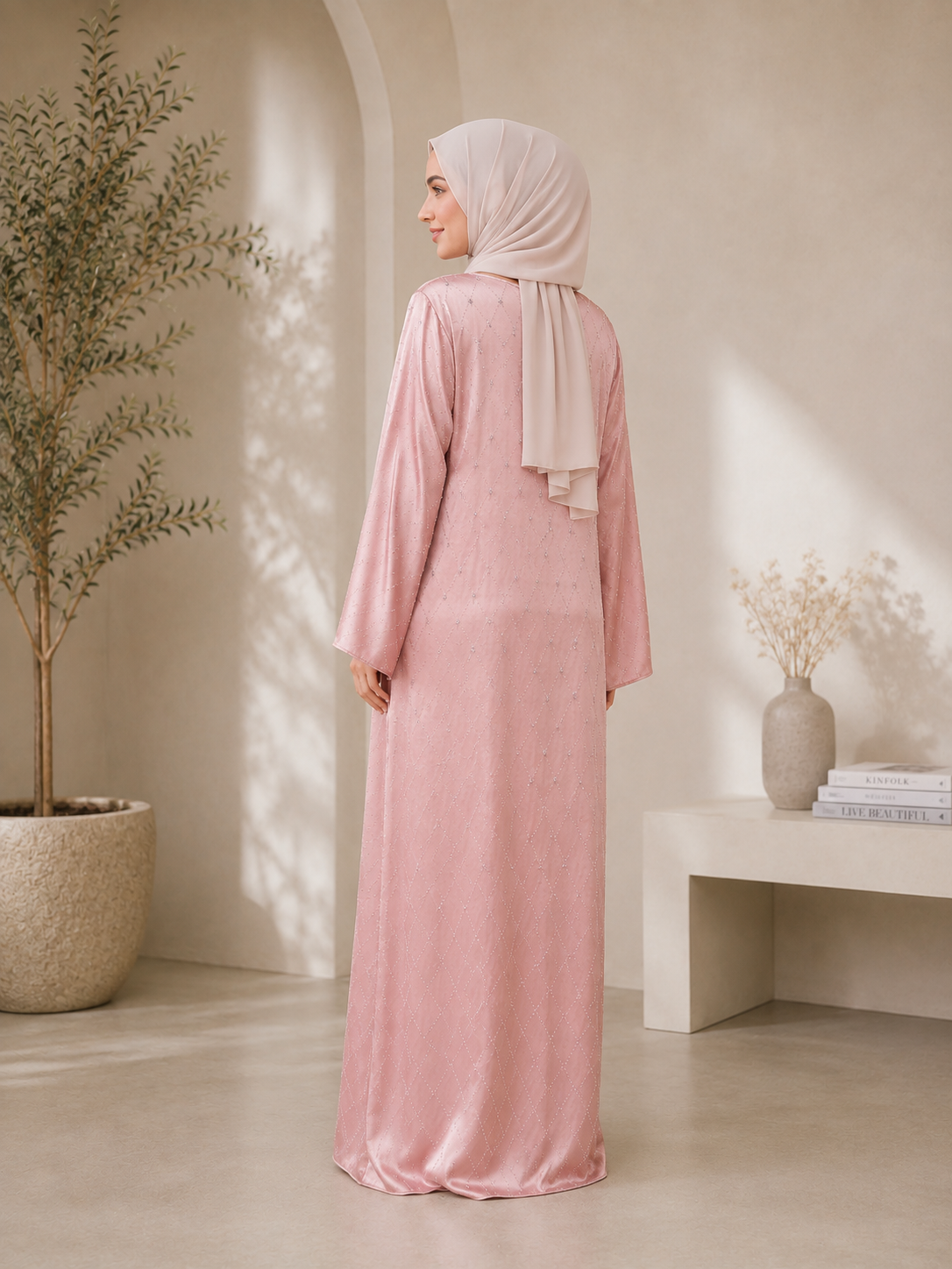Pink closed abaya with V-neck, small whites stones across abaya and adorned with raised stones that added texture and sparkles