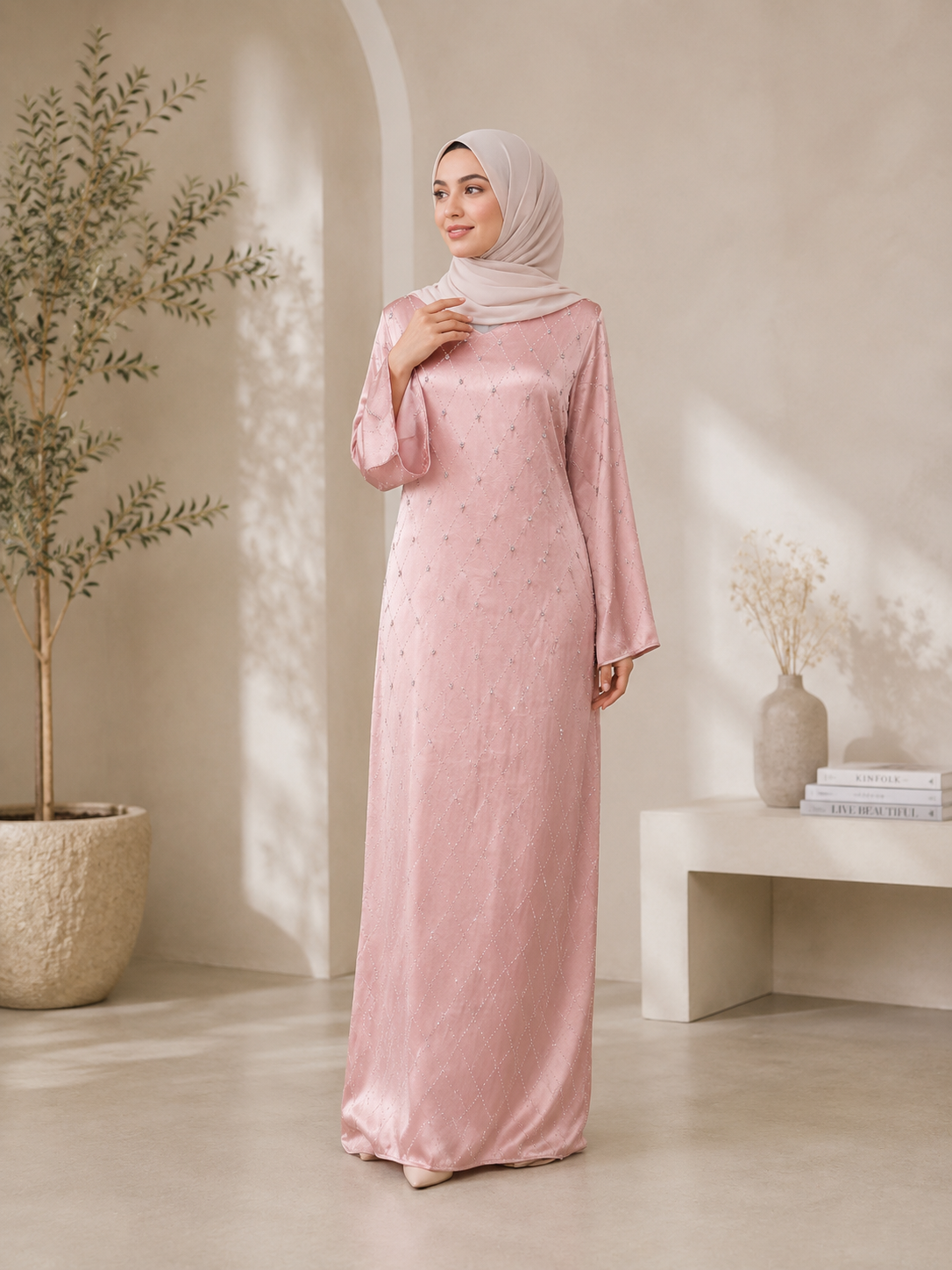 Pink closed abaya with V-neck, small whites stones across abaya and adorned with raised stones that added texture and sparkles