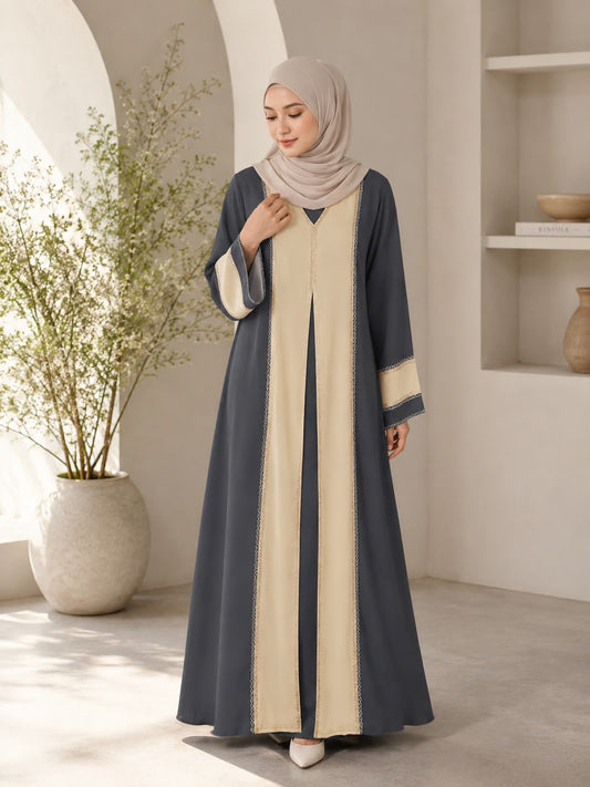 Elegant two-tone charcoal grey and beige colour combination
Flowing, modest and comfortable silhouette
Contrasting beige front panels for a refined layered effect
Delicate decorative trim detailing along the front panels
Wide flared sleeves with matching beige contrast accents
Beautifully designed for a graceful and feminine appearance
Versatile design suitable for both everyday and occasion wear
Easy to style with your favourite hijab and accessories