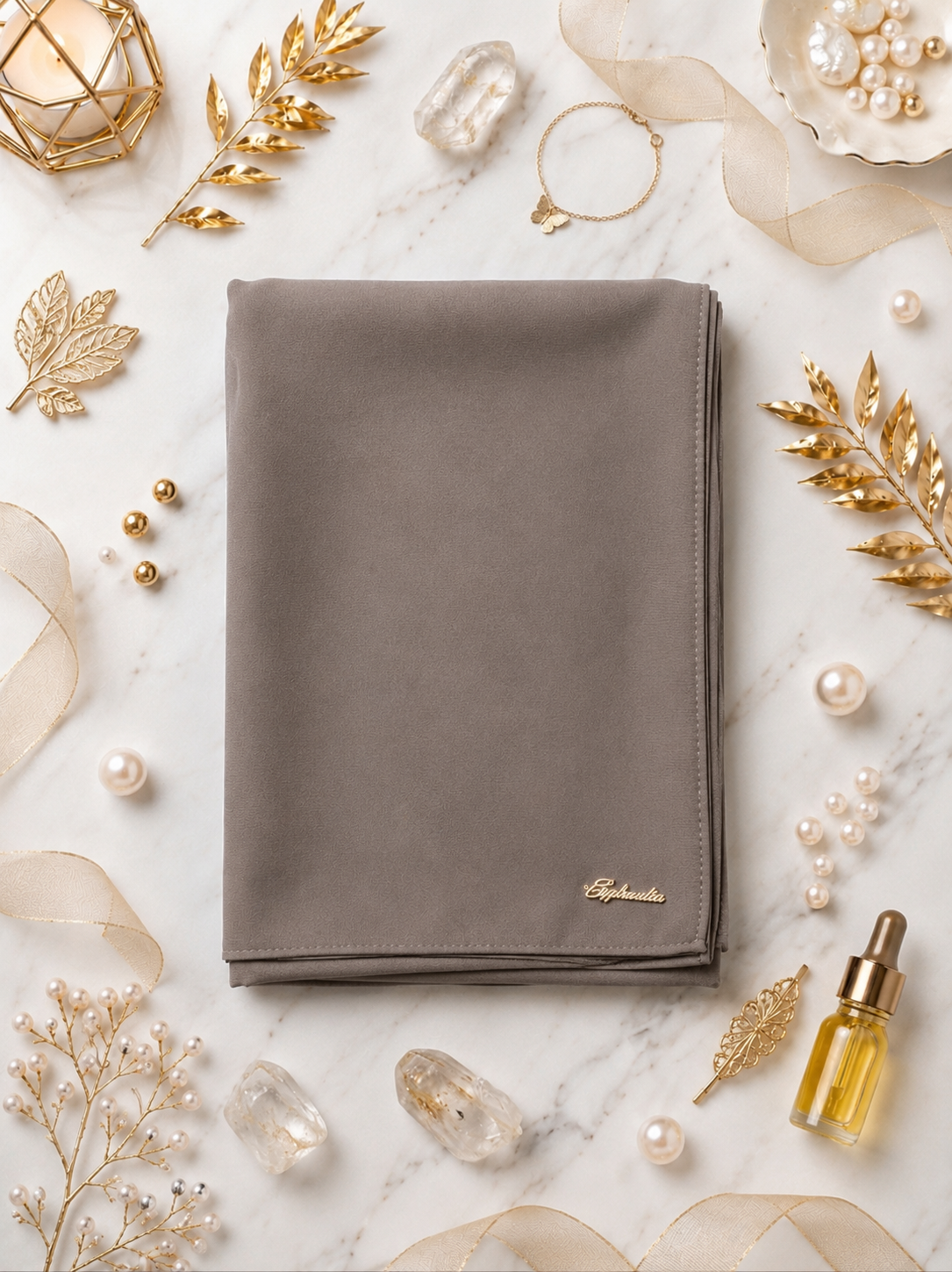 Graceful chiffon shawls with a soft, flowy drape. Light and airy, perfect for everyday wear or special occasions, finished with a subtle logo for a touch of understated elegance.
