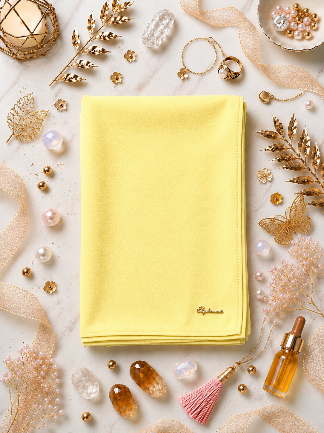 Canary Graceful chiffon shawls with a soft, flowy drape. Light and airy, perfect for everyday wear or special occasions, finished with a subtle logo for a touch of understated elegance.