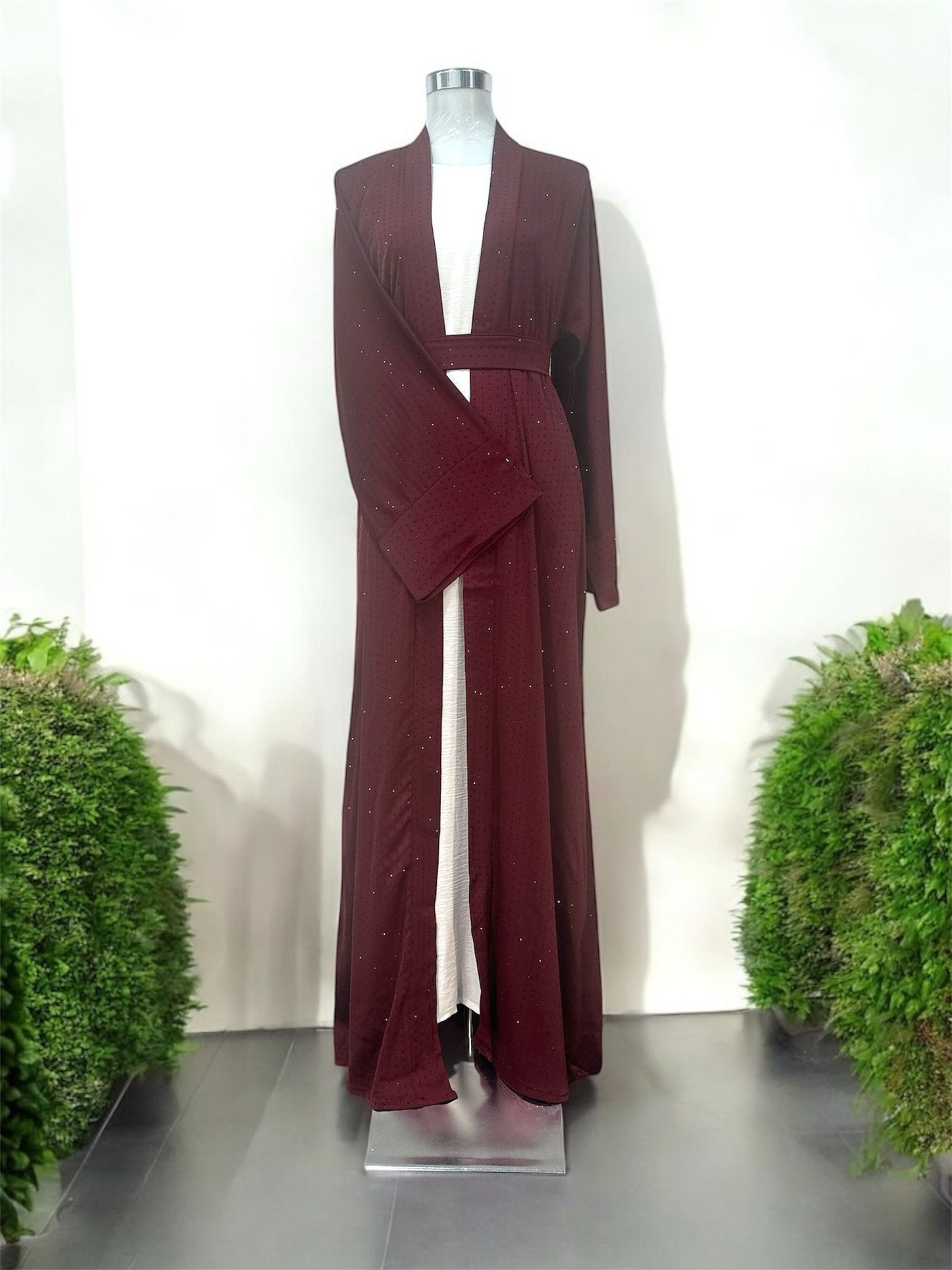 Marroon Lamura Abaya was designed in an overcoat style, featuring delicate blue stone embellishments across the overcoat for sophisticated looks and short sleeve innerwear providing comfort. Comes complete with a coordinating cloth belt and matching shawl.