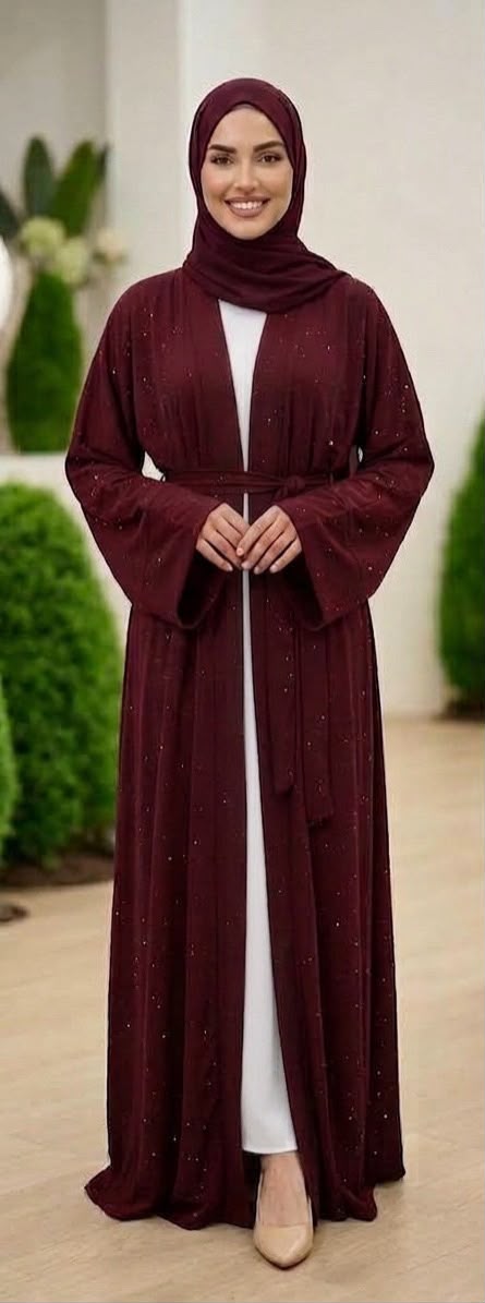 Marroon Lamura Abaya was designed in an overcoat style, featuring delicate blue stone embellishments across the overcoat for sophisticated looks and short sleeve innerwear providing comfort. Comes complete with a coordinating cloth belt and matching shawl.