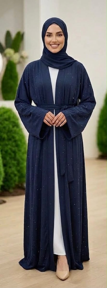 Navy Lamura Abaya was designed in an overcoat style, featuring delicate blue stone embellishments across the overcoat for sophisticated looks and short sleeve innerwear providing comfort. Comes complete with a coordinating cloth belt and matching shawl.
