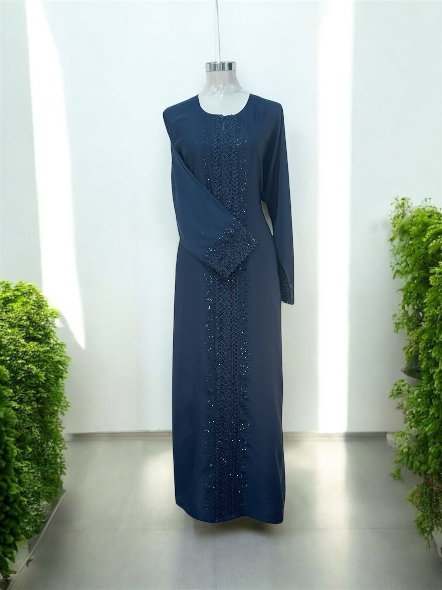 Navy Rana Jubah - with snap
button, bottom 
sleeve and front abaya embroided and embellish
with dark blue tiny stones and comes with shawl"




