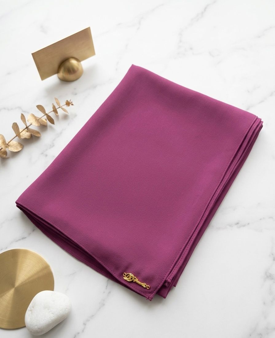 Graceful chiffon shawls with a soft, flowy drape. Light and airy, perfect for everyday wear or special occasions, finished with a subtle logo for a touch of understated elegance.
