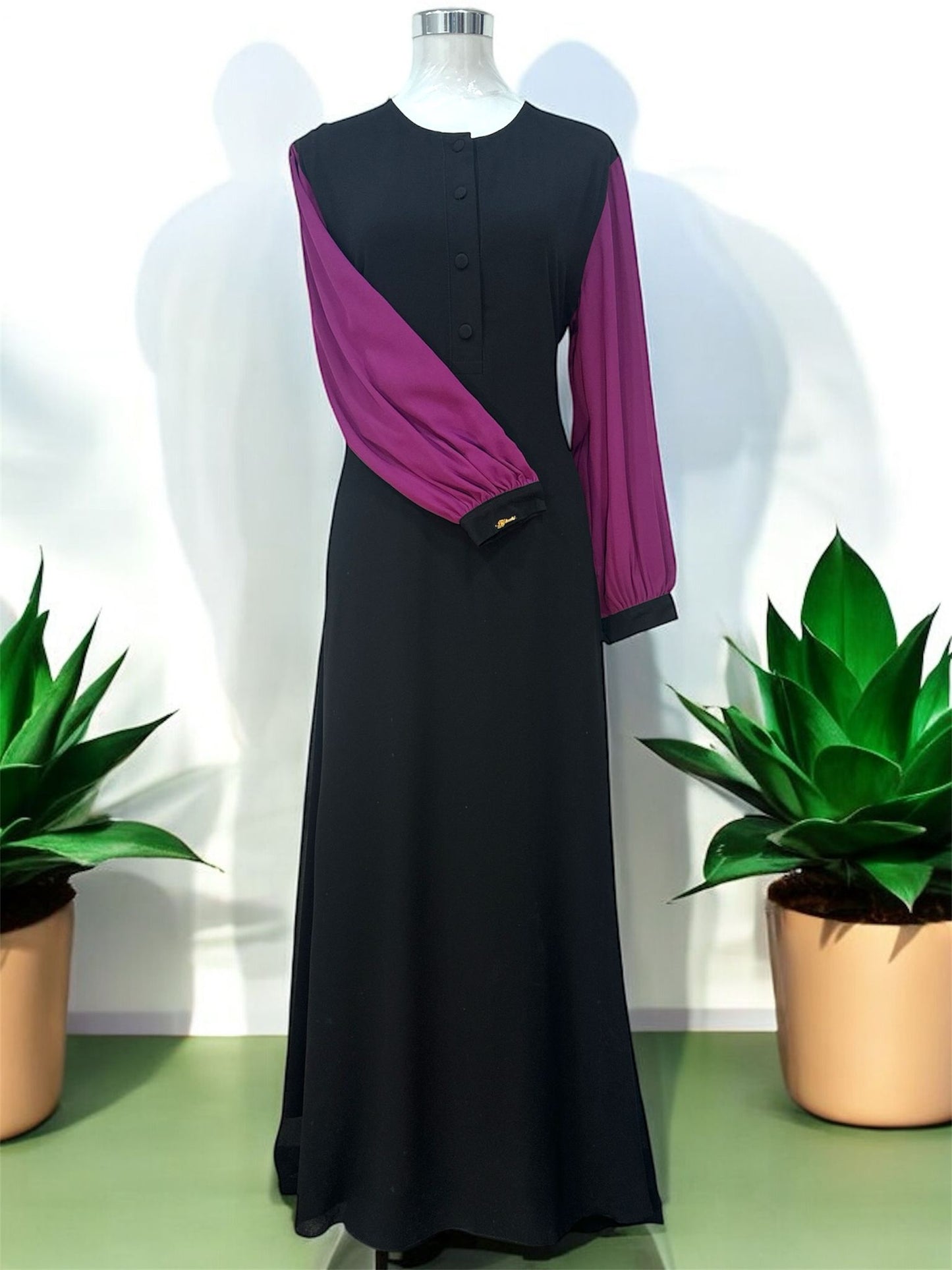 Purple Ulfah jubah features contrast sleeve accents, a polished front button placket, and structured banded cuffs for a contemporary finish.