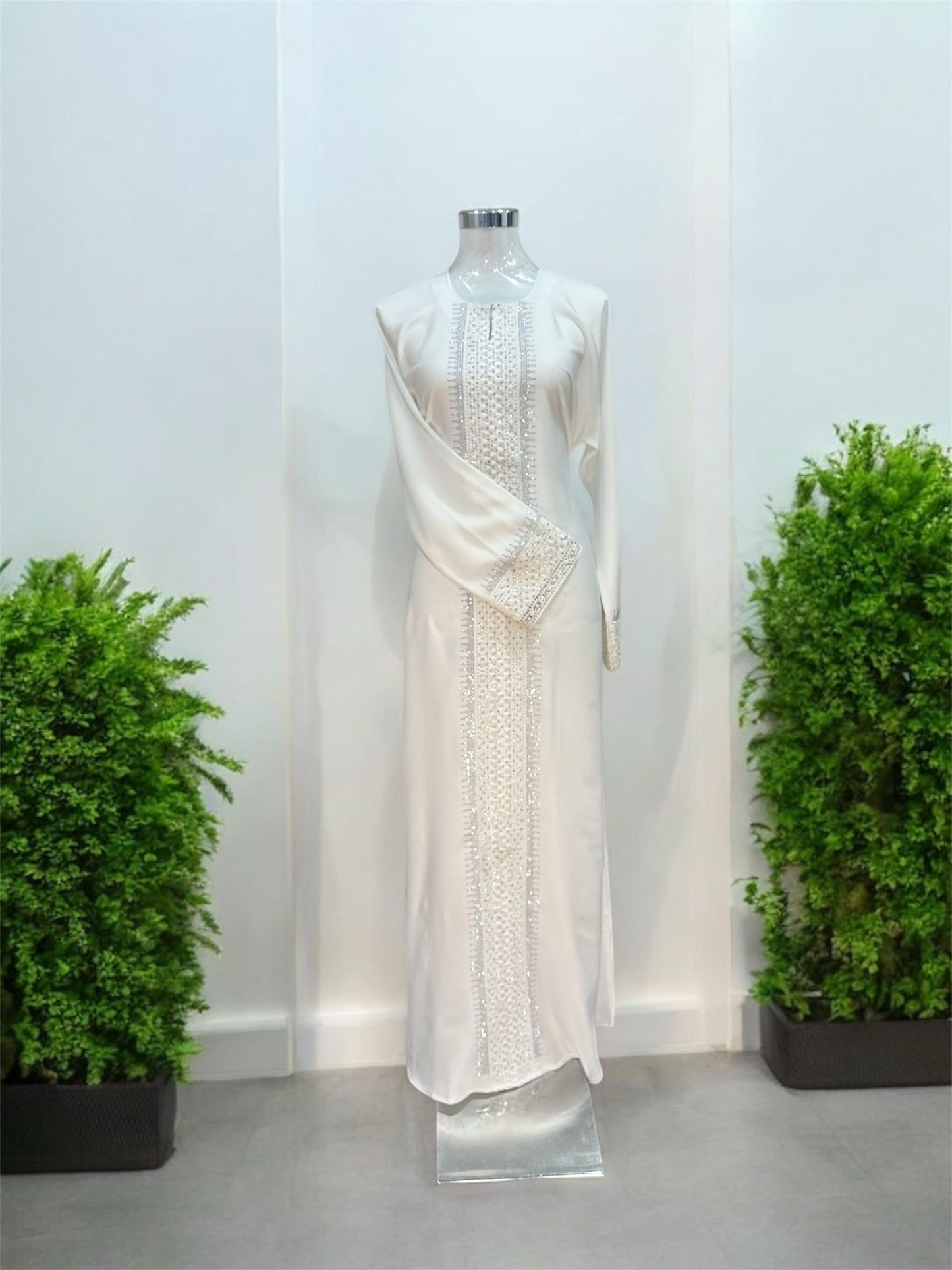 White Rana Jubah - with snap
button, bottom 
sleeve and front abaya embroided and embellish
with white tiny stones and comes with shawl