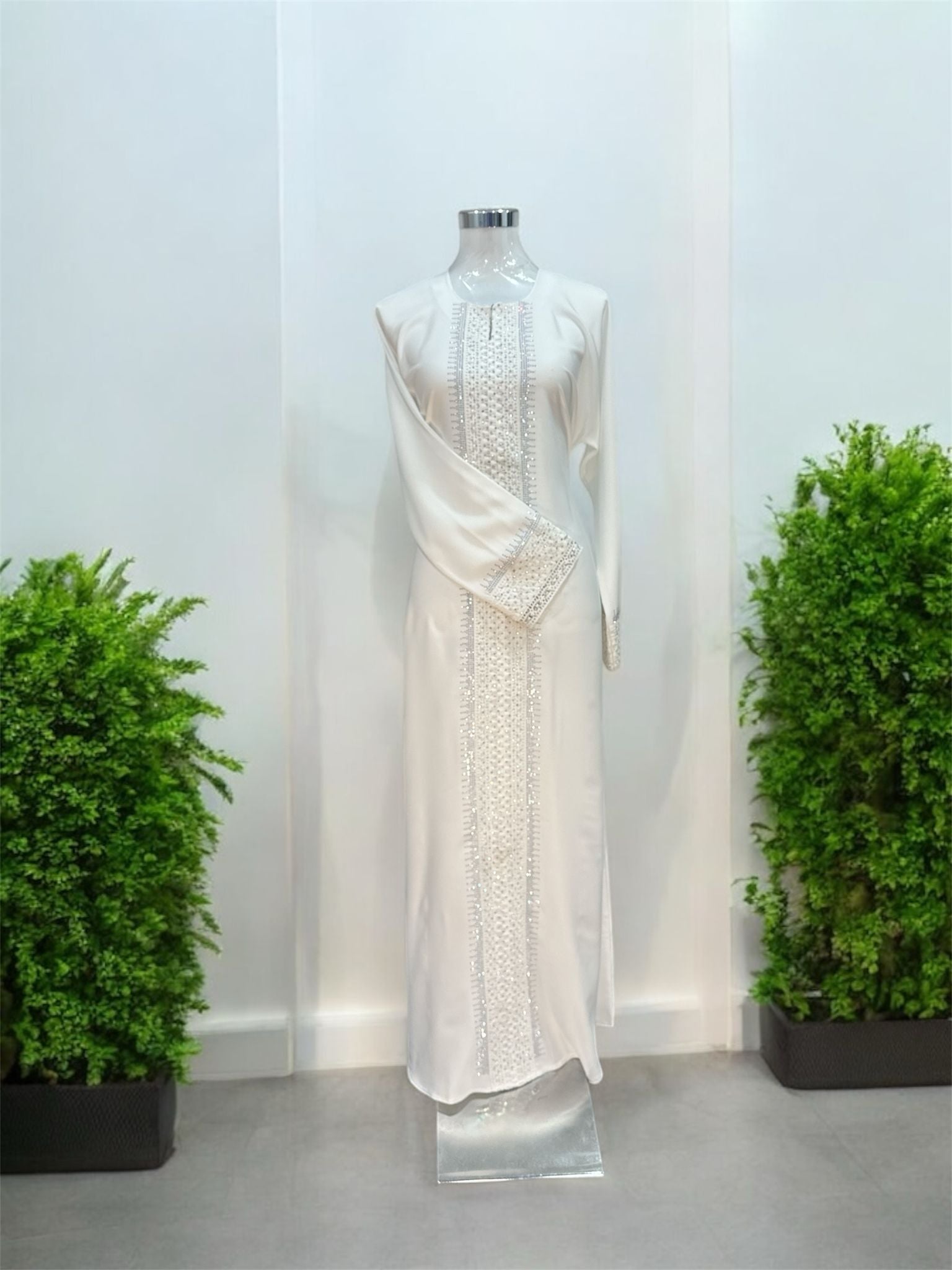 White Rana Jubah - with snap
button, bottom 
sleeve and front abaya embroided and embellish
with white tiny stones and comes with shawl